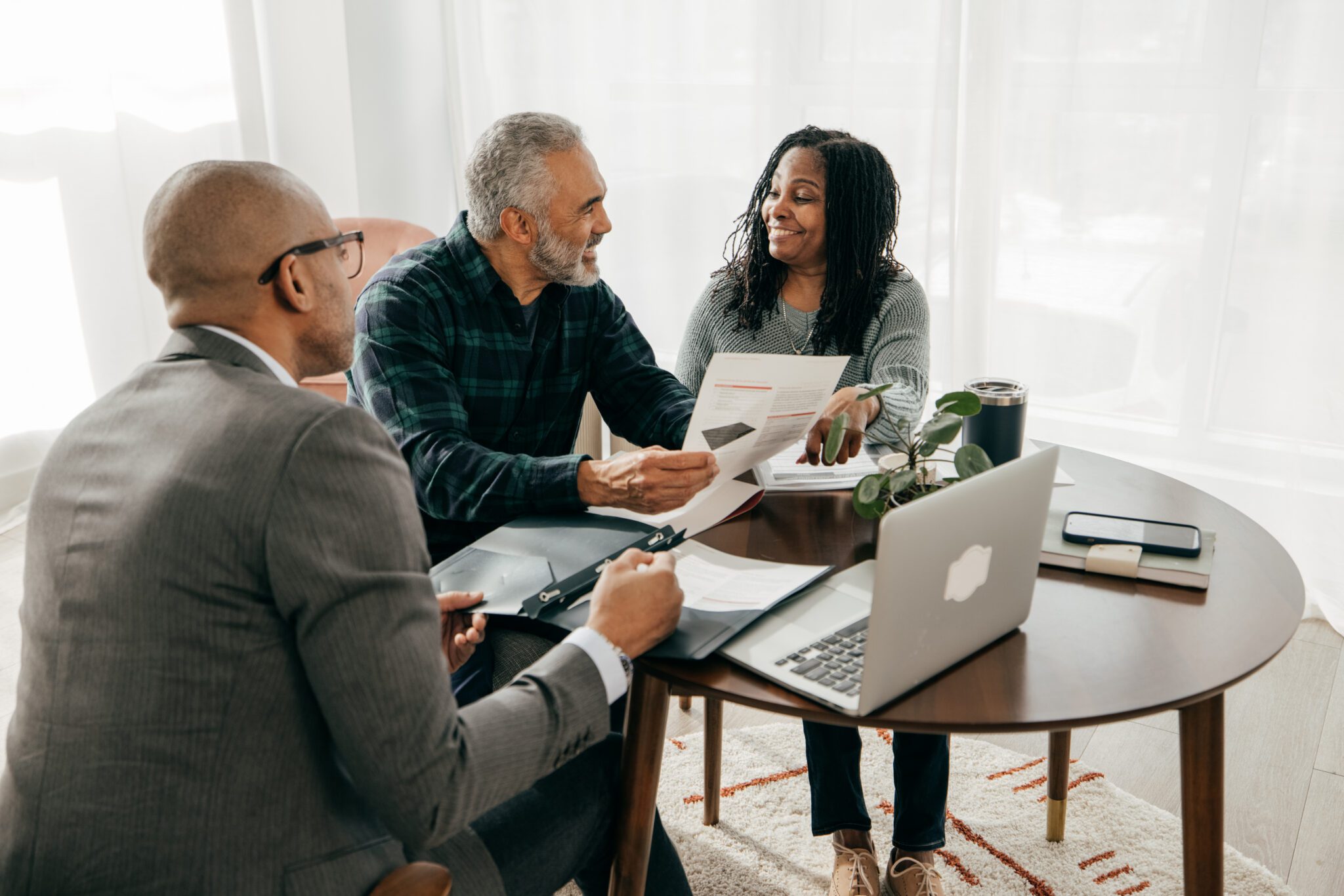Professionals reviewing paperwork together