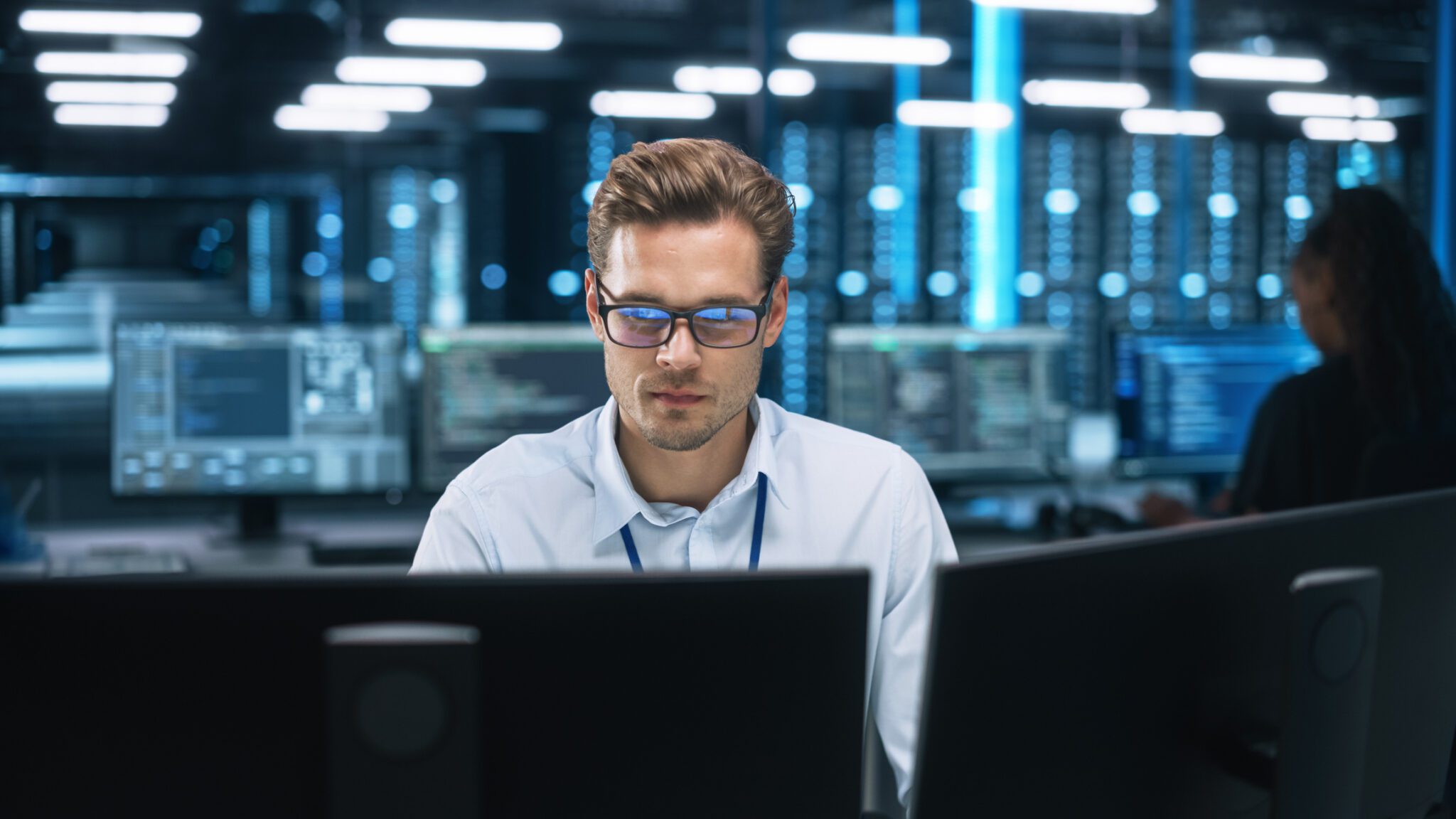 Man working in a technology data center.