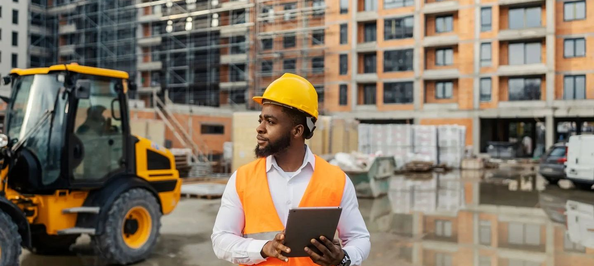 Engineer inspecting site with tablet