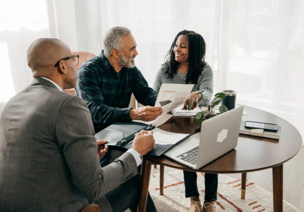 Professionals reviewing paperwork together