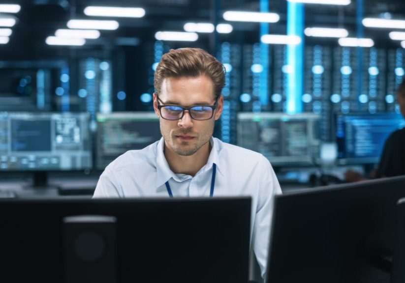 Man working in a technology data center.